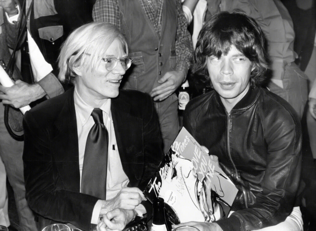 andy-warhol’s-polaroid-of-mick-jagger-touching-tongues-with-a-woman-could-be-yours