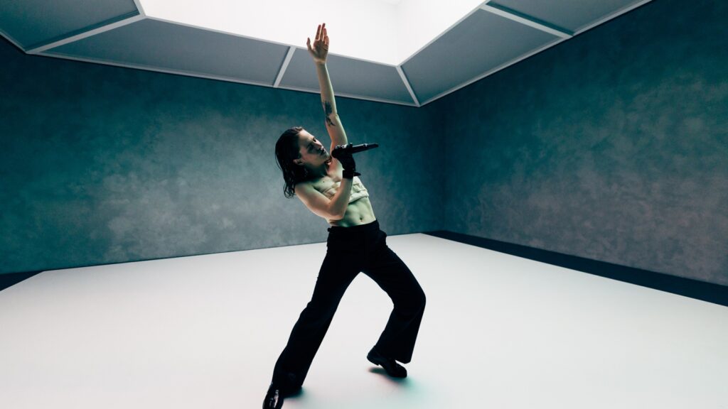 see-christine-and-the-queens-translate-mourning-into-movement-in-‘angels-crying-in-my-bed’-video