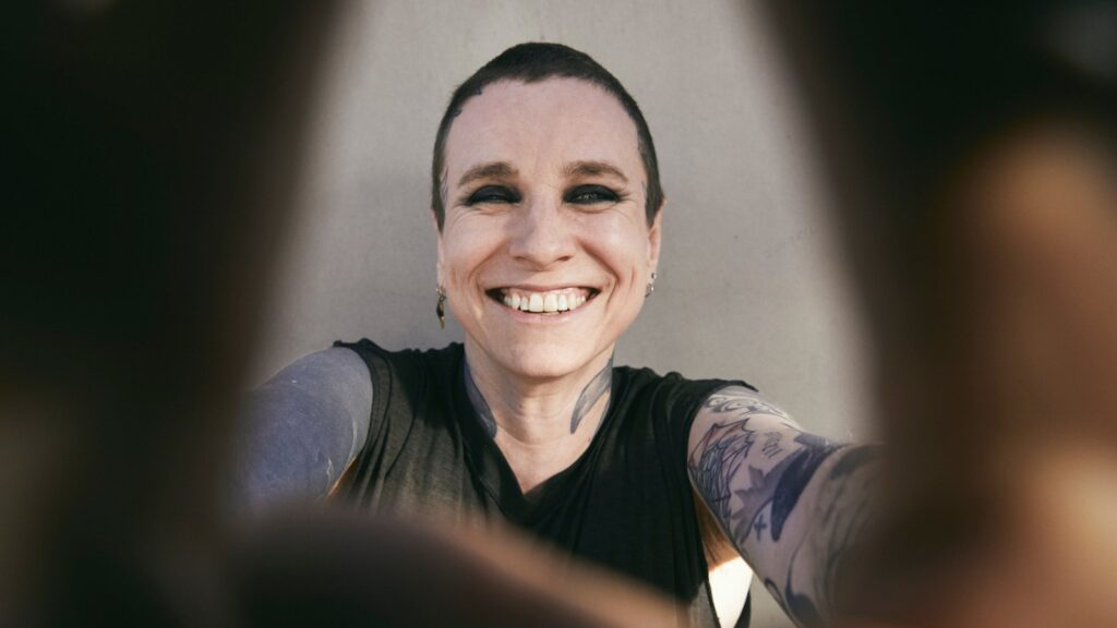 laura-jane-grace-wears-cotton-armor-on-new-single-‘dysphoria-hoodie’