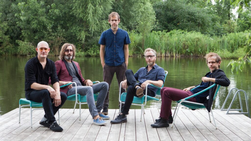 the-national,-phoebe-bridgers-escape-a-flood-of-heartbreak-and-hilarity-in-‘laugh-track’-video