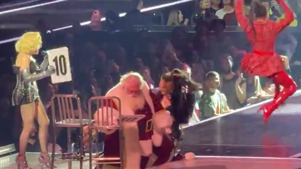 santa-gets-lap-dance-at-madonna-show,-falls-off-chair